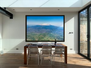 Etna Spring, acrylic glass print in Hamburg frame, in an interior